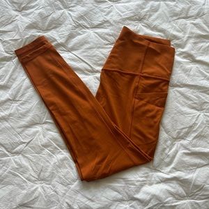Athleta Orange Salutation Stash Tights
